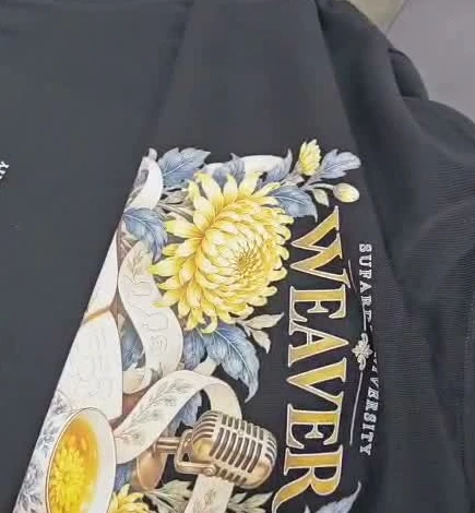 Real Sufardi University merchandise: a black WEAVER shirt with flowers and a microphone